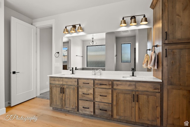 3134 E Blue Heron Dr S, St George, UT 84790 - full bath featuring double vanity, wood finished floors, and baseboards