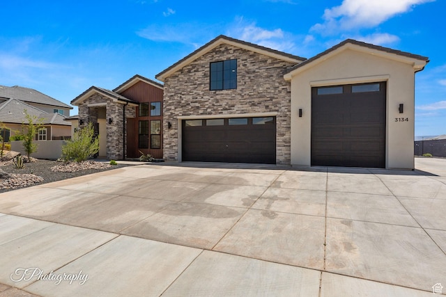 3134 E Blue Heron Dr S, St George, UT 84790 - contemporary home featuring stone siding, concrete driveway, stucco siding, and an attached garage