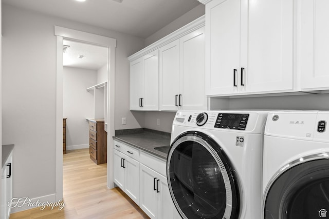 3134 E Blue Heron Dr S, St George, UT 84790 - laundry room featuring independent washer and dryer, cabinet space, light wood-type flooring, and baseboards