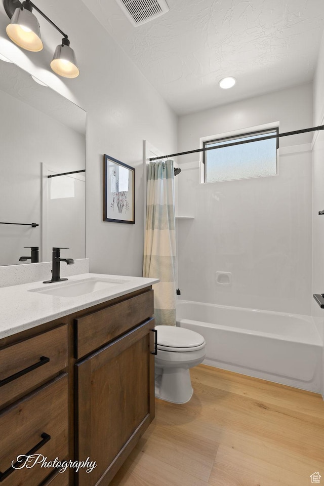 3134 E Blue Heron Dr S, St George, UT 84790 - bathroom with shower / tub combo, vanity, wood finished floors, and toilet
