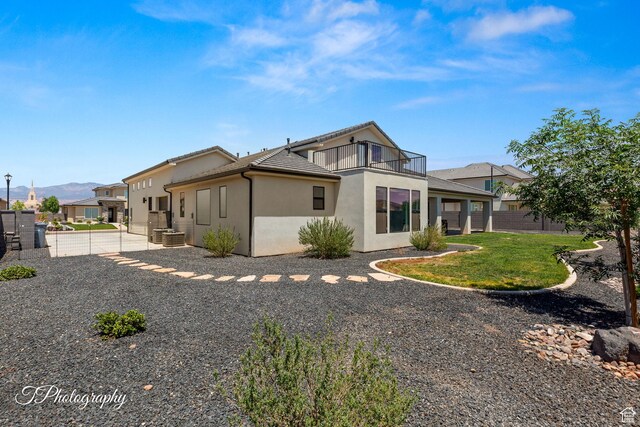 3134 E Blue Heron Dr S, St George, UT 84790 - back of property featuring a balcony, stucco siding, a mountain view, a tile roof, and central air condition unit