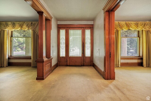 157 N 500 W, Logan, UT 84321 - foyer entrance with carpet, baseboards, and ornate columns