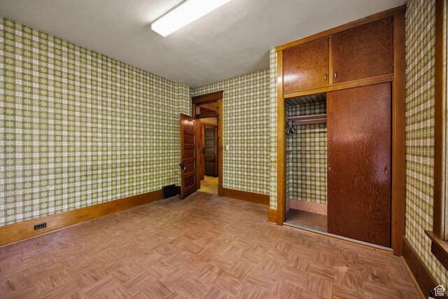 157 N 500 W, Logan, UT 84321 - unfurnished bedroom with baseboards, a closet, and wallpapered walls
