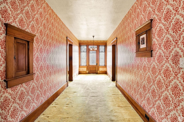 157 N 500 W, Logan, UT 84321 - hallway with wallpapered walls, baseboards, light carpet, and a textured ceiling