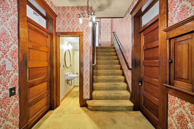 157 N 500 W, Logan, UT 84321 - stairs with wallpapered walls, carpet, a chandelier, and baseboards