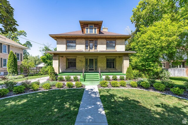157 N 500 W, Logan, UT 84321 - traditional style home featuring brick siding and covered porch