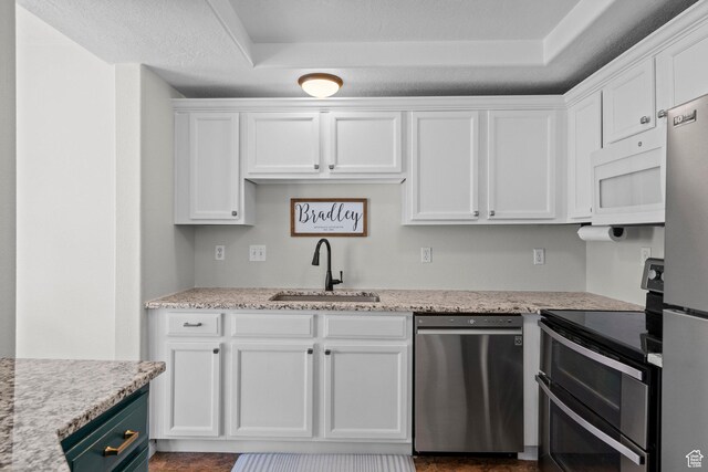 79 W 1970 N, Tooele, UT 84074 - kitchen featuring appliances with stainless steel finishes, a sink, and white cabinets