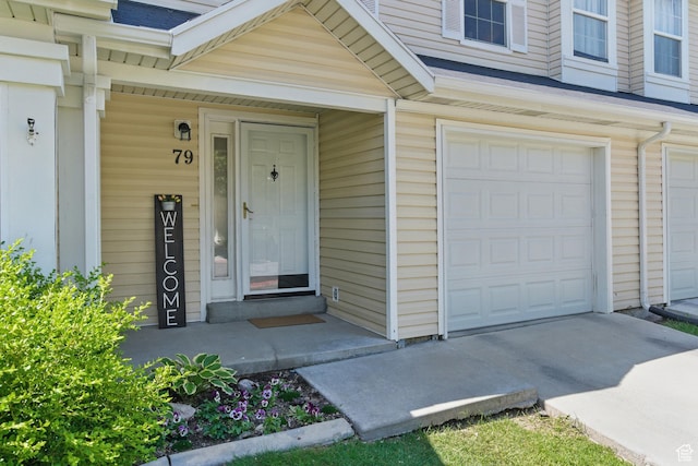 79 W 1970 N, Tooele, UT 84074 - doorway to property featuring a garage and concrete driveway