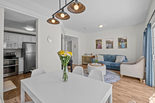 79 W 1970 N, Tooele, UT 84074 - dining room featuring light wood-style floors