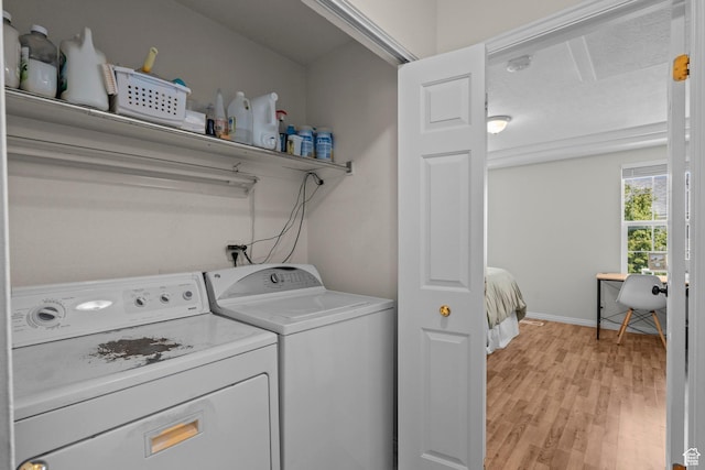 79 W 1970 N, Tooele, UT 84074 - laundry room featuring washer and clothes dryer, light wood-style floors, and baseboards