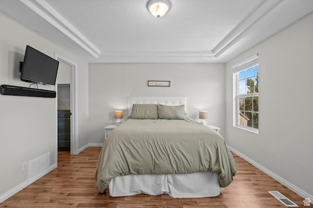 79 W 1970 N, Tooele, UT 84074 - bedroom with a tray ceiling, wood finished floors, and baseboards