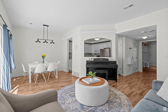 79 W 1970 N, Tooele, UT 84074 - living area with light wood-style floors and baseboards