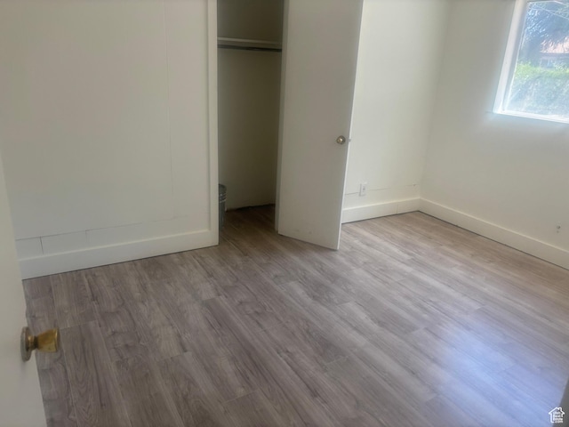 4575 W 4925 S, Kearns, UT 84118 - unfurnished bedroom with wood finished floors, a closet, and baseboards