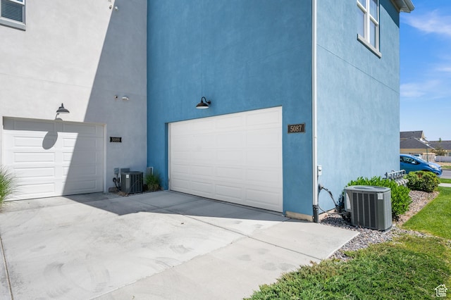 5087 W Rambutan Way S, Jordan, UT 84009 - garage featuring central AC and concrete driveway
