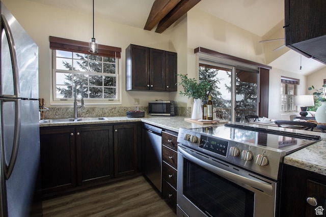 874 W Schneitter Cir Unit 7, Midway, UT 84049 - kitchen featuring appliances with stainless steel finishes, dark wood-style floors, light stone counters, pendant lighting, and a sink