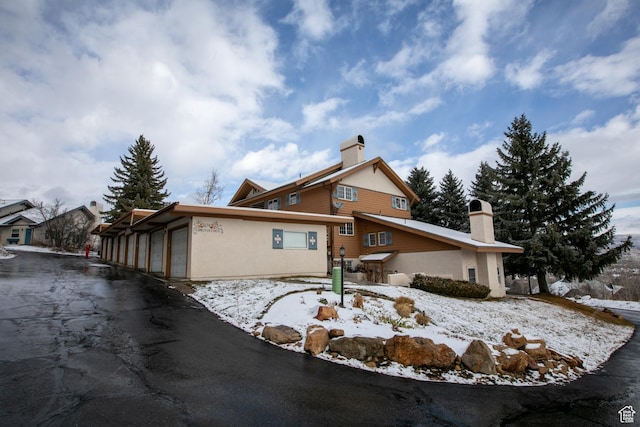 874 W Schneitter Cir Unit 7, Midway, UT 84049 - snow covered rear of property with a chimney