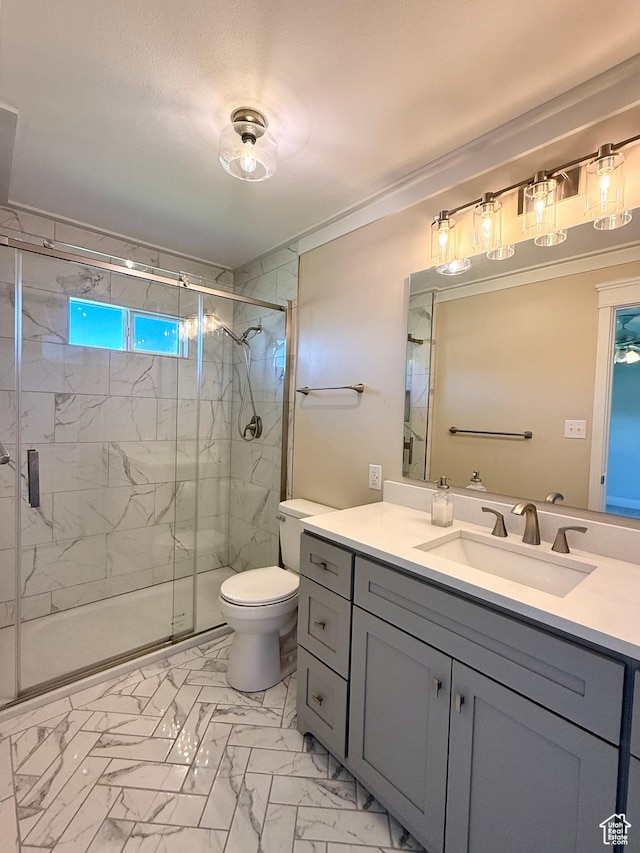 737 S 400 E, Payson, UT 84651 - bathroom featuring marble finish flooring, vanity, a marble finish shower, and toilet