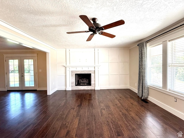 737 S 400 E, Payson, UT 84651 - unfurnished living room with plenty of natural light, dark wood-style floors, a textured ceiling, baseboards, and crown molding