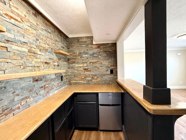 737 S 400 E, Payson, UT 84651 - bar featuring freestanding refrigerator, a textured ceiling, light wood-style floors, and crown molding