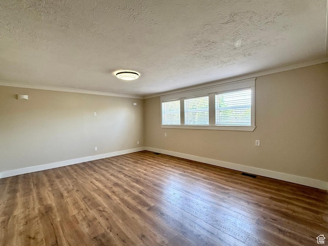 737 S 400 E, Payson, UT 84651 - unfurnished room with crown molding, a textured ceiling, wood finished floors, and baseboards