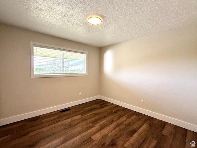 737 S 400 E, Payson, UT 84651 - unfurnished room featuring baseboards, dark wood finished floors, and a textured ceiling