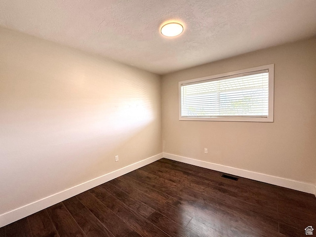 737 S 400 E, Payson, UT 84651 - empty room with baseboards, dark wood-style flooring, and a textured ceiling