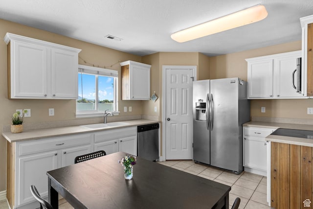 1099 W 200 S, Springville, UT 84663 - kitchen featuring appliances with stainless steel finishes, a sink, white cabinetry, and light tile patterned floors
