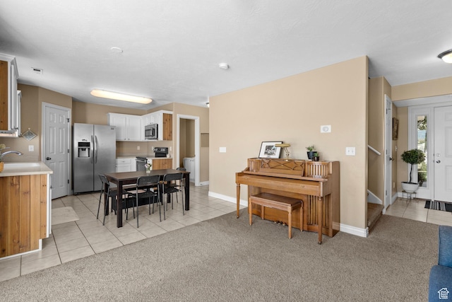 1099 W 200 S, Springville, UT 84663 - dining room with light tile patterned floors, light carpet, and baseboards