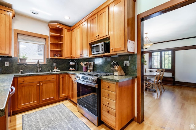 1376 E Perry Ave, Salt Lake City, UT 84103 - kitchen with stainless steel appliances, light wood-style floors, open shelves, backsplash, and recessed lighting