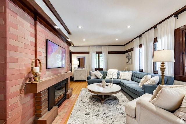 1376 E Perry Ave, Salt Lake City, UT 84103 - living room with recessed lighting, crown molding, and a glass covered fireplace