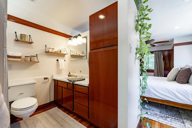 1376 E Perry Ave, Salt Lake City, UT 84103 - bathroom featuring vanity, wood finished floors, and ensuite bathroom