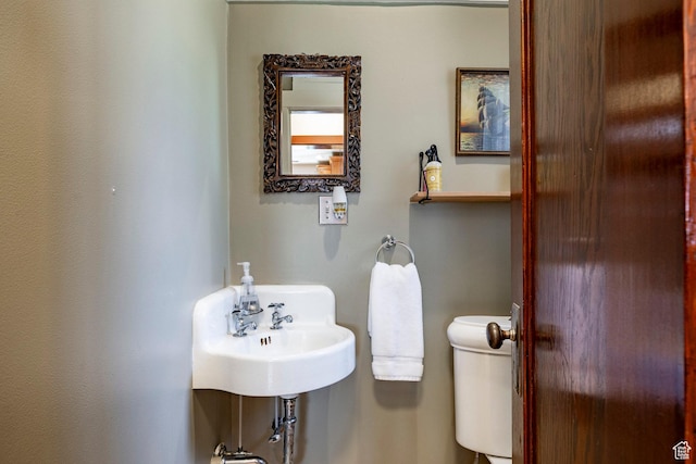 1376 E Perry Ave, Salt Lake City, UT 84103 - half bathroom featuring toilet and a sink