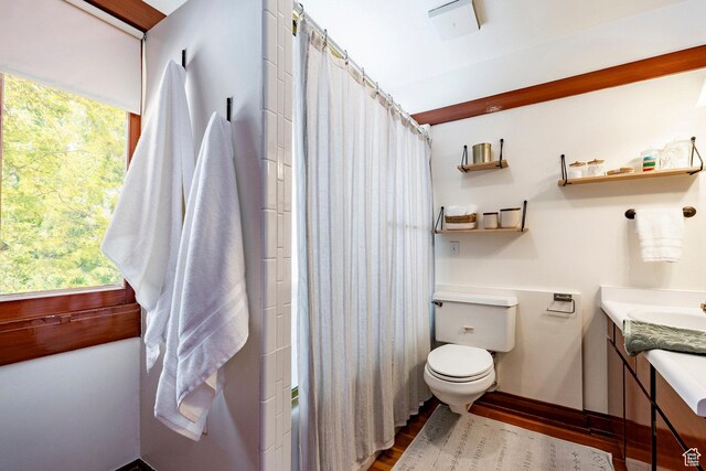1376 E Perry Ave, Salt Lake City, UT 84103 - full bathroom featuring vanity, wood finished floors, and shower / tub combo