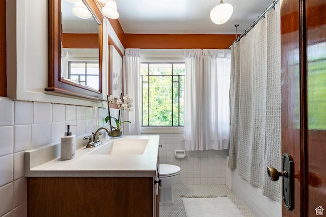 1376 E Perry Ave, Salt Lake City, UT 84103 - full bathroom featuring tile walls, vanity, and tile patterned floors