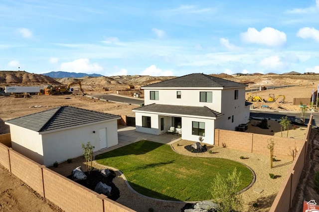 6068 S White Trails Dr, St George, UT 84790 - back of property with a mountain view, stucco siding, and a patio area