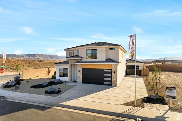 6068 S White Trails Dr, St George, UT 84790 - contemporary home featuring an attached garage, a mountain view, concrete driveway, and stucco siding