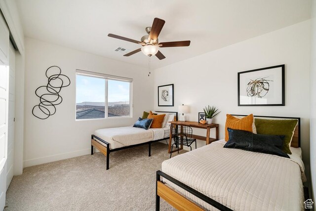 6068 S White Trails Dr, St George, UT 84790 - bedroom featuring baseboards, light colored carpet, ceiling fan, and a closet