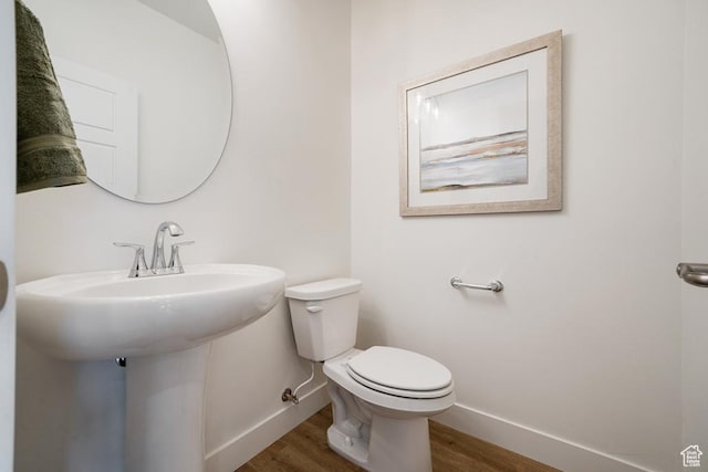 6068 S White Trails Dr, St George, UT 84790 - bathroom featuring baseboards, wood finished floors, and toilet
