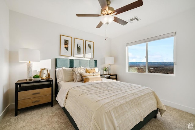 6068 S White Trails Dr, St George, UT 84790 - bedroom featuring light carpet, baseboards, and a ceiling fan