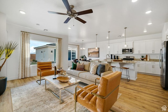 6068 S White Trails Dr, St George, UT 84790 - living area featuring light wood-type flooring, ceiling fan, and recessed lighting