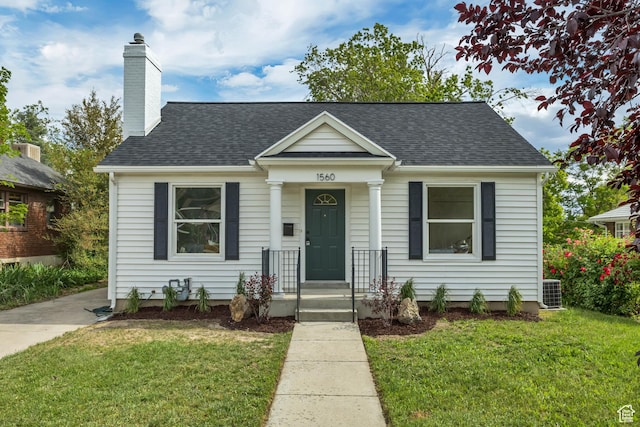 1560 E Downington Ave S, Salt Lake City, UT 84105 - bungalow-style home featuring a front lawn, a chimney, and a shingled roof