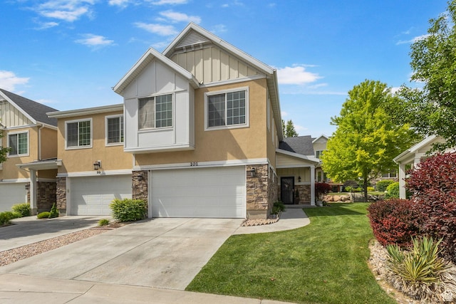 101 E Mansonia Dr S, Draper, UT 84020 - view of front facade with board and batten siding, stone siding, a garage, and a front yard