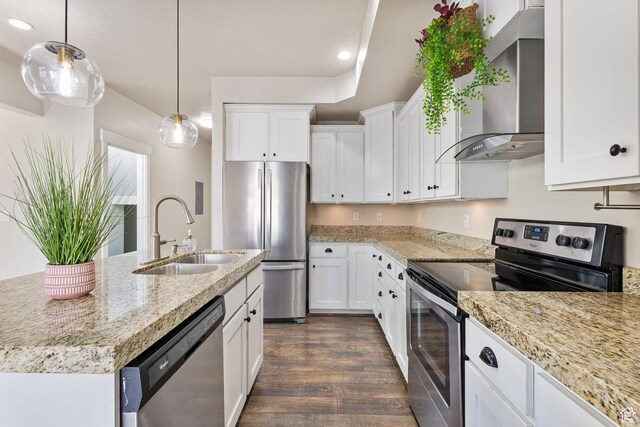 101 E Mansonia Dr S, Draper, UT 84020 - kitchen featuring stainless steel appliances, a sink, wall chimney range hood, dark wood-style flooring, and white cabinets
