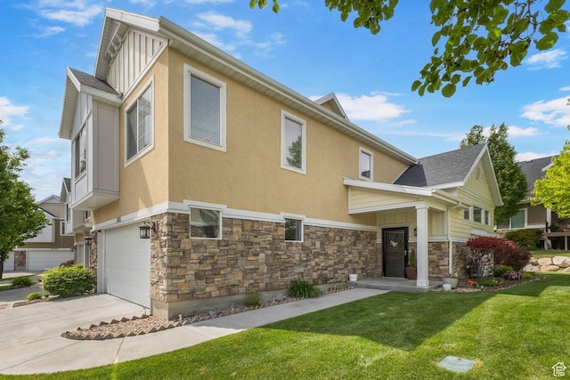 101 E Mansonia Dr S, Draper, UT 84020 - back of house featuring stone siding, a garage, and a lawn
