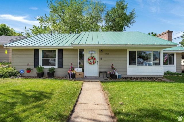 1225 E 5th St, Ogden, UT 84404 - view of front facade with a standing seam roof, a front yard, and metal roof