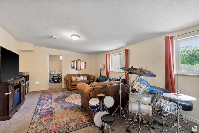1225 E 5th St, Ogden, UT 84404 - carpeted living area featuring a textured ceiling and baseboards
