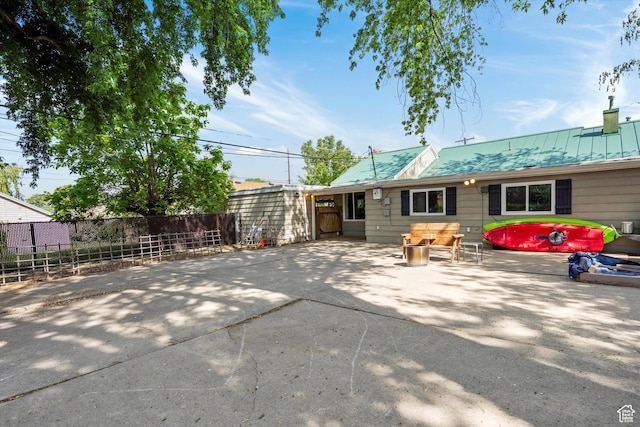 1225 E 5th St, Ogden, UT 84404 - rear view of property with a patio and metal roof