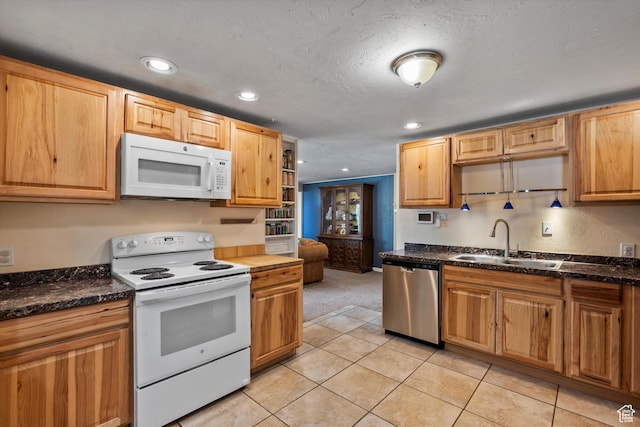 1225 E 5th St, Ogden, UT 84404 - kitchen with white appliances, a sink, recessed lighting, light tile patterned floors, and light colored carpet