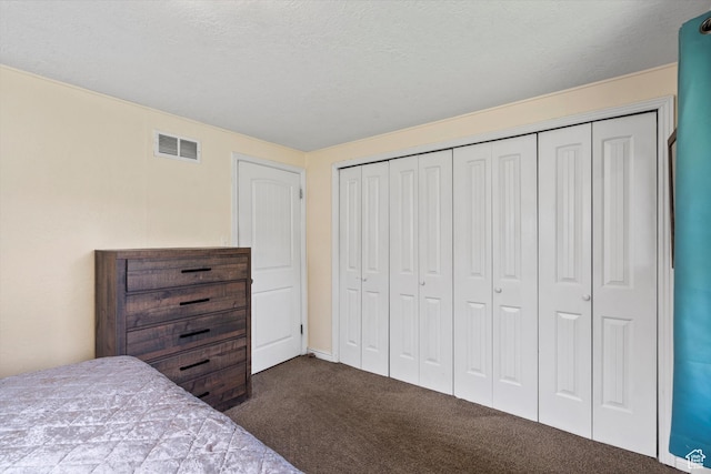 1225 E 5th St, Ogden, UT 84404 - bedroom with dark carpet and a closet