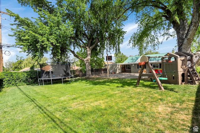 1225 E 5th St, Ogden, UT 84404 - view of yard with a trampoline, a playground, and a patio area